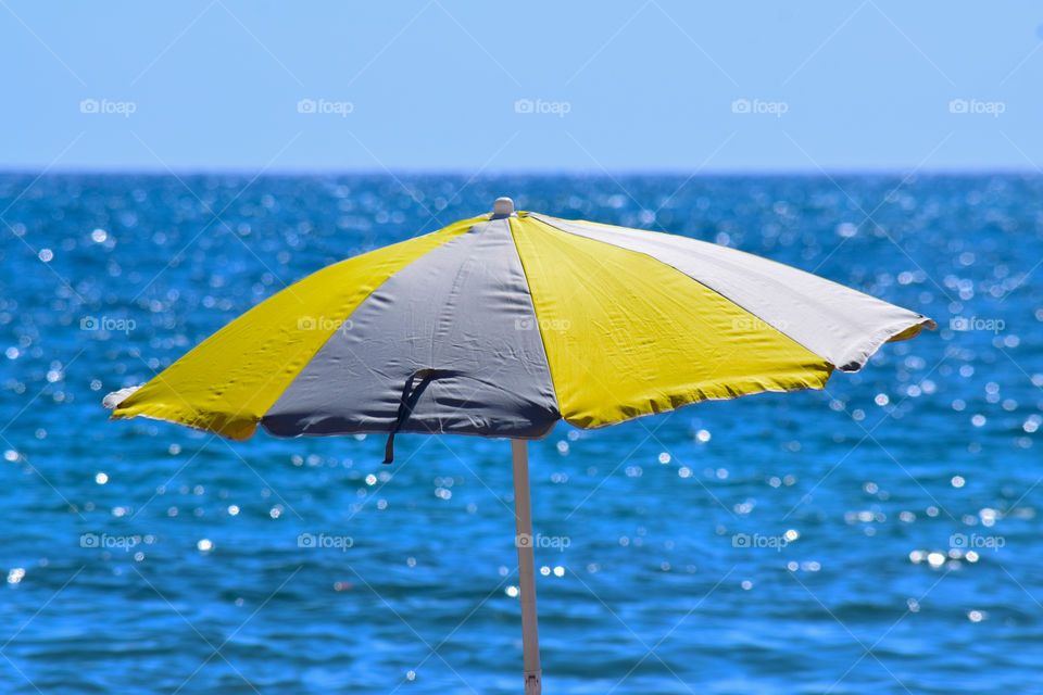 A colorful umbrella on the beach 