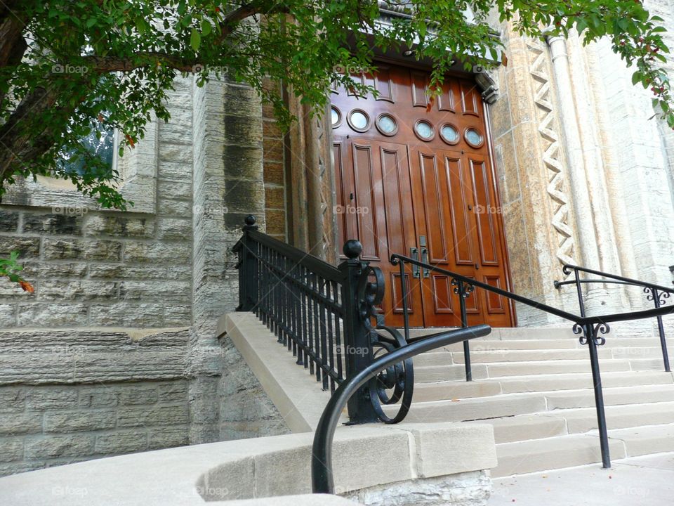 Railing, stairs, big wood door