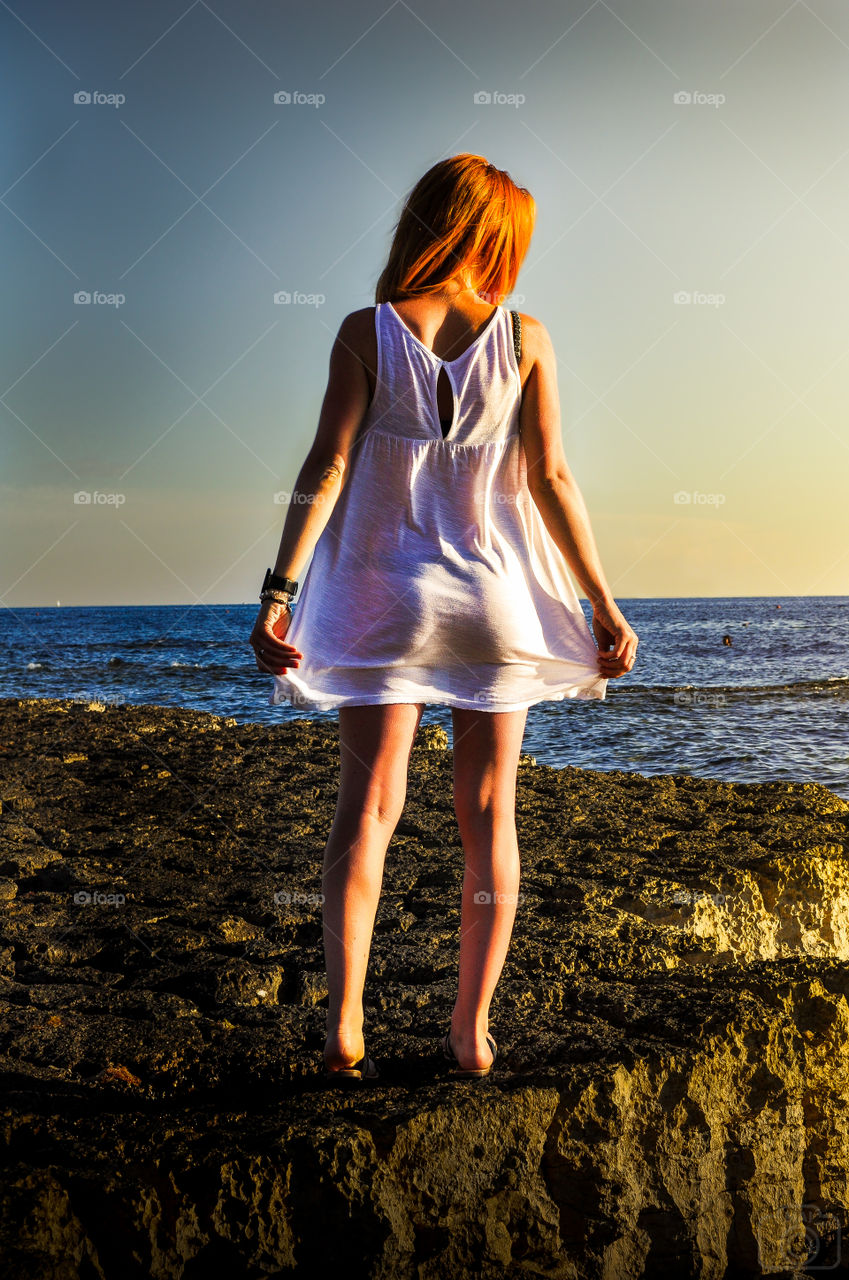 Girl on water background