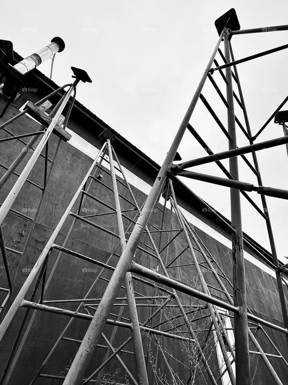 Boat stands tower into the sky, waiting to hold ships above the ground so they can be worked on.