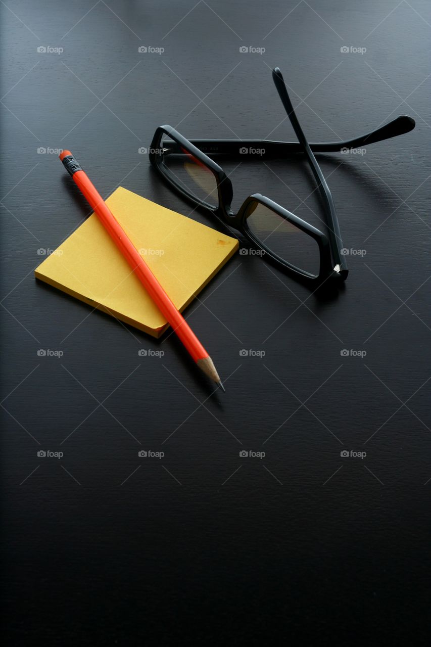 pencil, notepad and eyeglasses. photo of pencil, notepad and eyeglasses