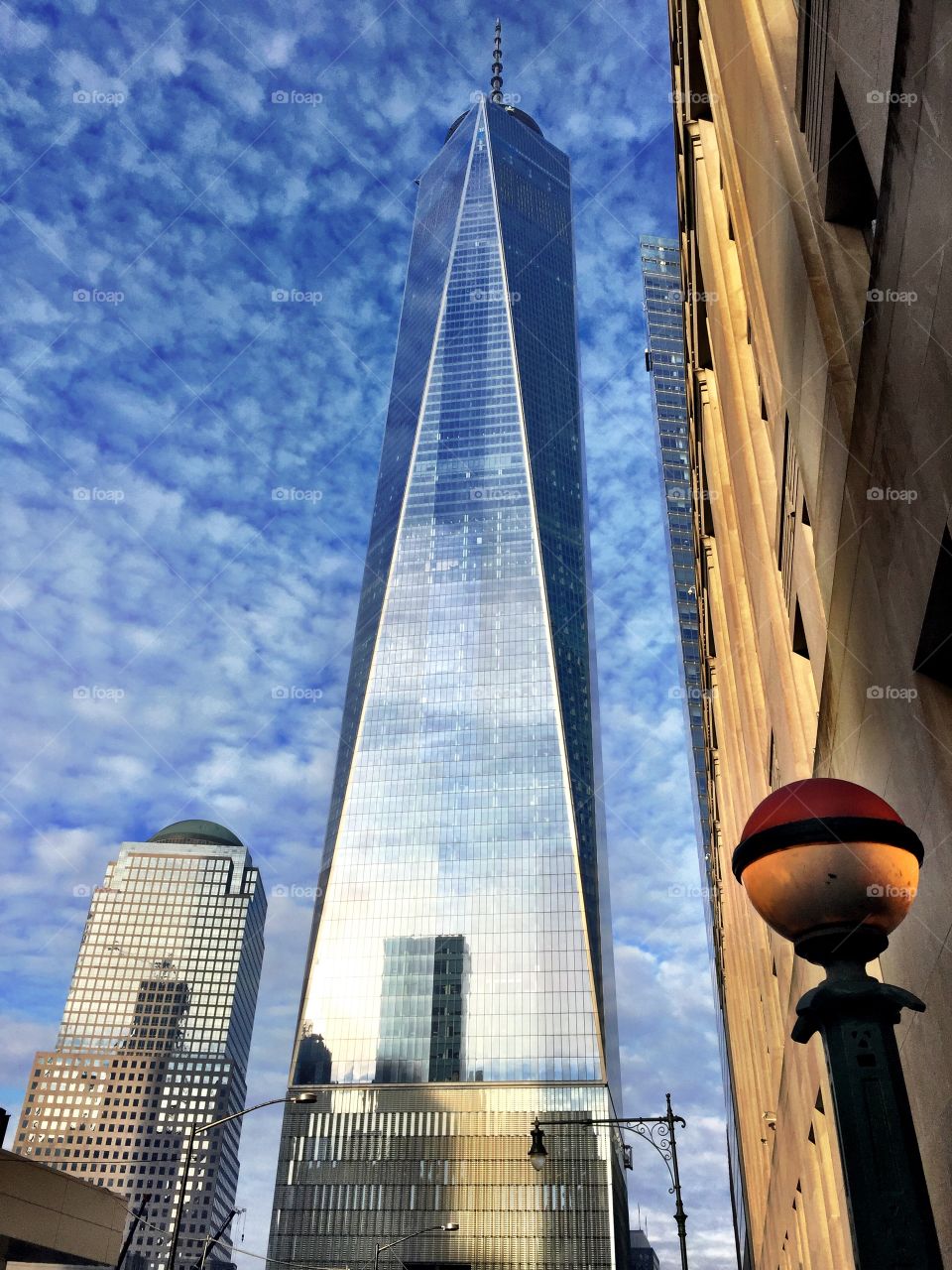 Sidewalk view upward of One World Trade in New York