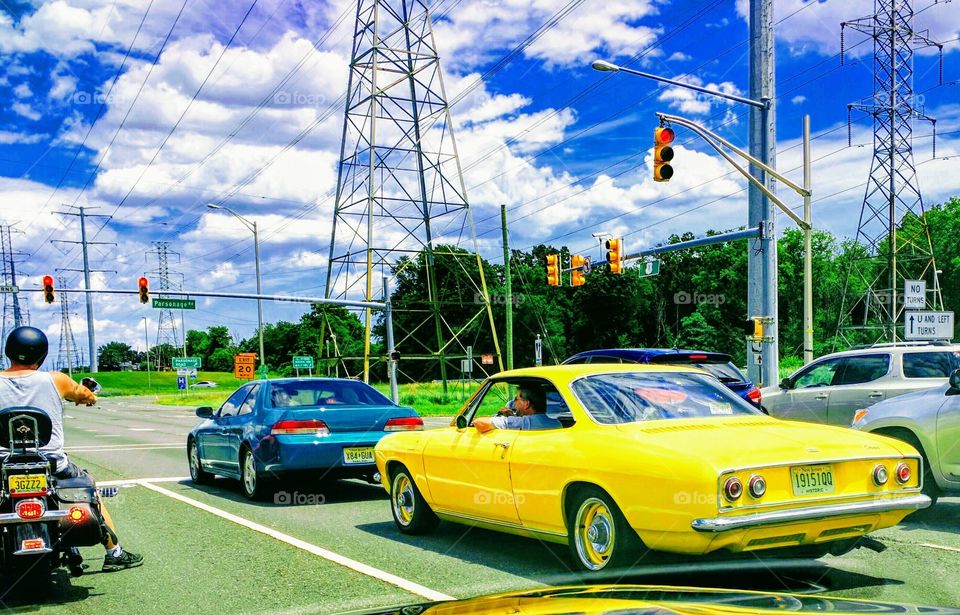 yellow car at red light