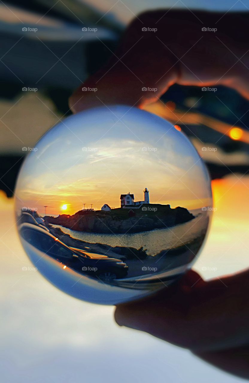 lighthouse threw crystal ball at sunrise