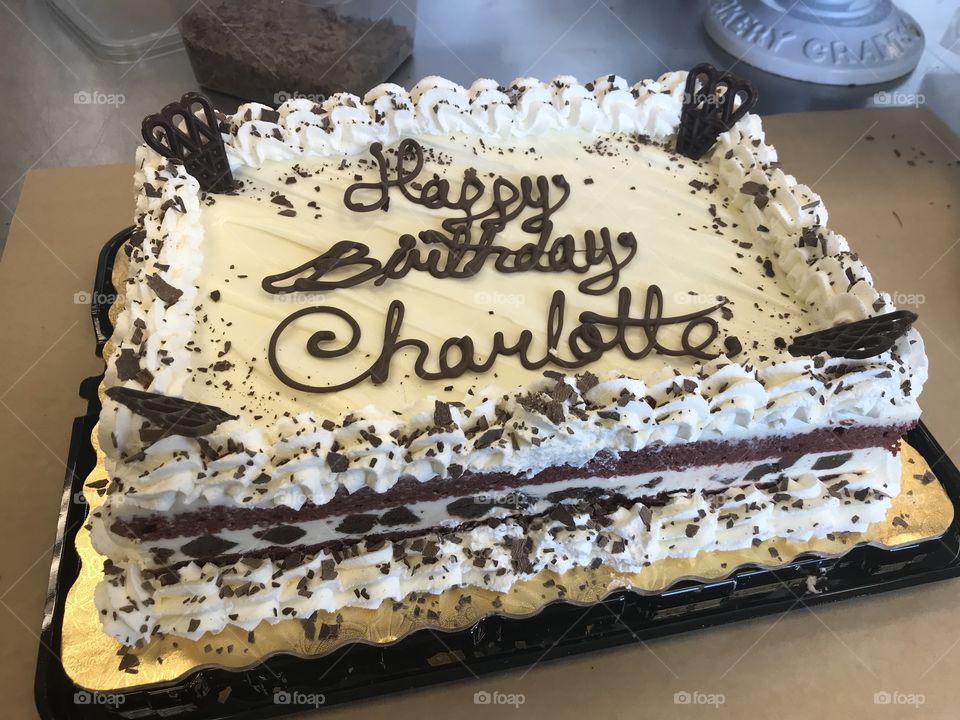 Red velvet birthday cake with whip cream border