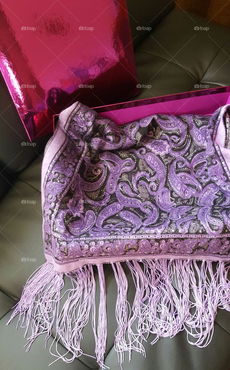 my purple paisley shawl I keep in a purple shiney box. I wear it occasionally.