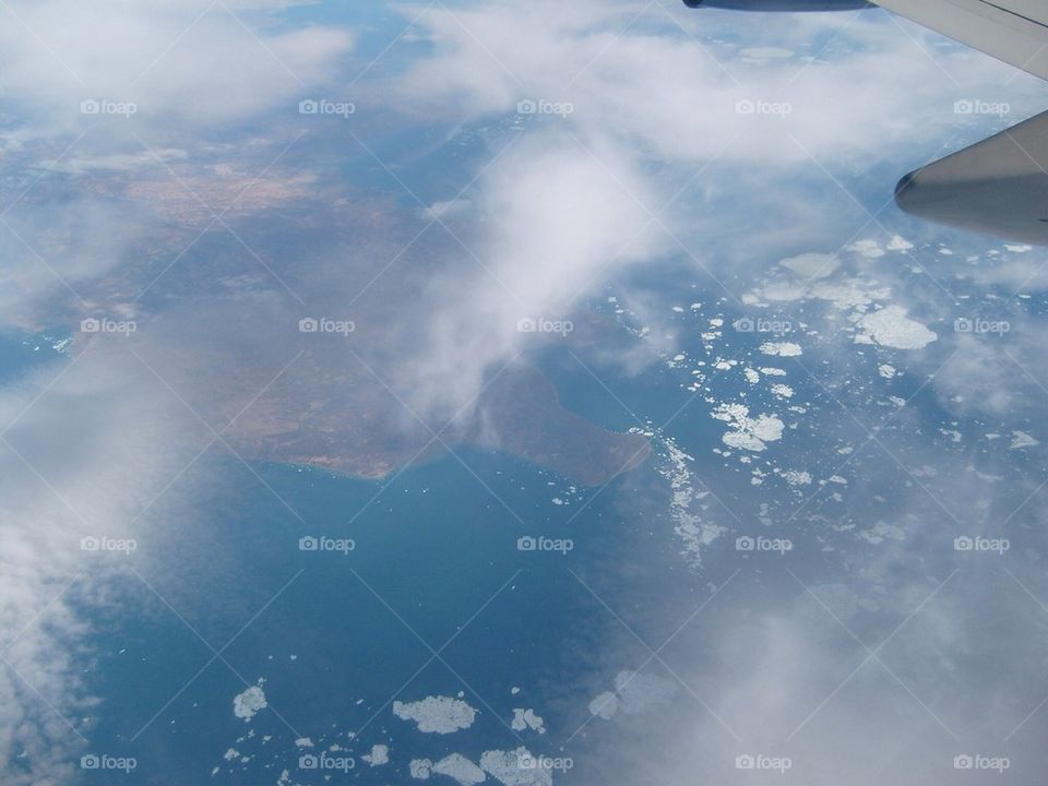Plane ride over ocean and land