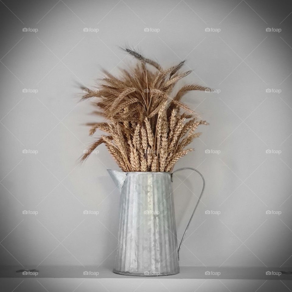 Rustic Metal Jug with Dried Wheat Stalks