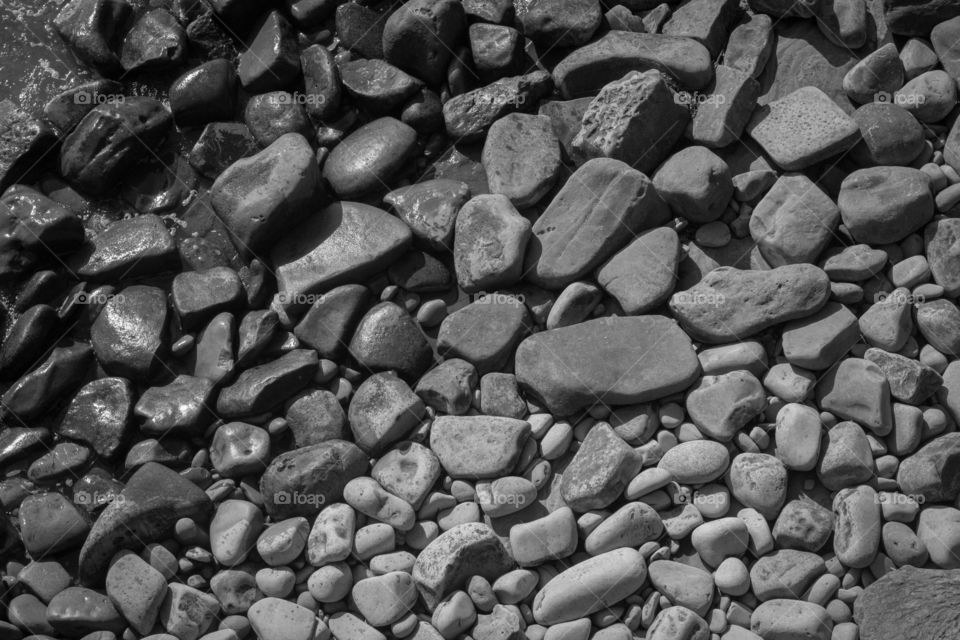 textured black and white fading pattern of rocks