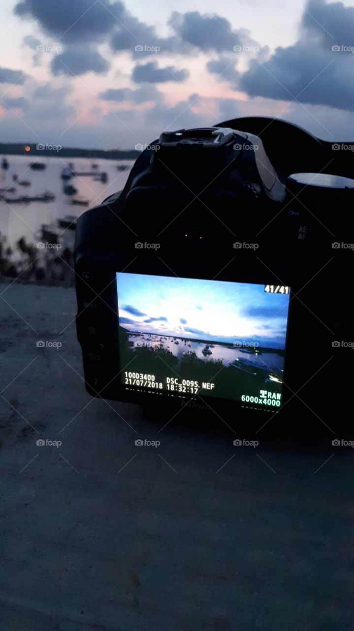 taking landscape picture with dslr camera  at sunset