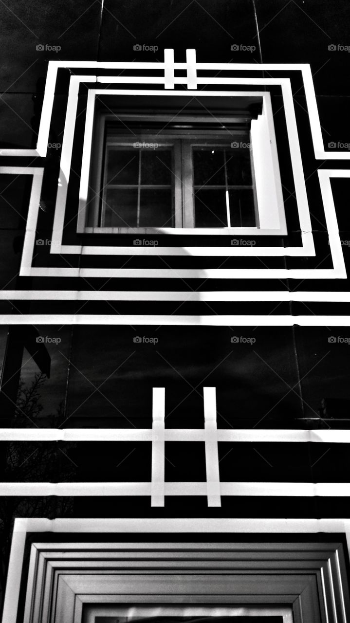 Architecture. Black Glass & White Trimmed Facade