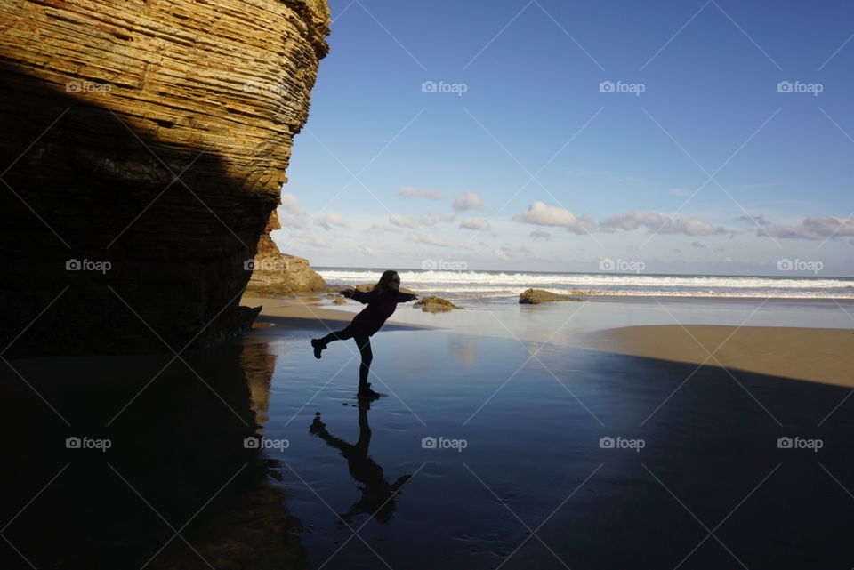 Beach#ocean#sky#clouds#rocks#human#position#balance#reflect