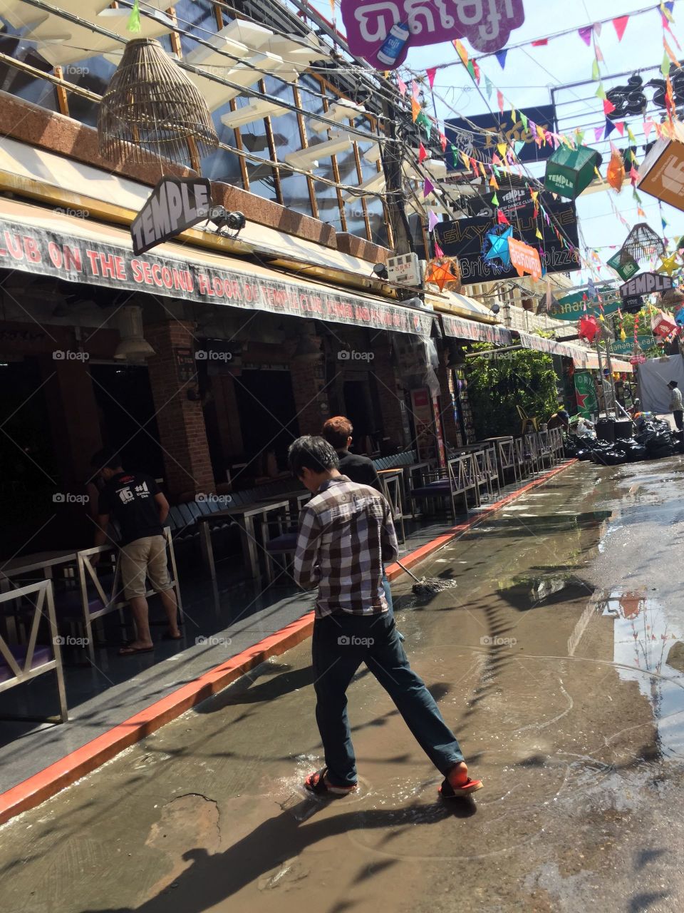 Cambodia Photos of Pub Street after The Cambodian New Year. Holy Water Throwing Holiday. CM Photography April 2019.  @chelseamerkleyphotos on Foap.