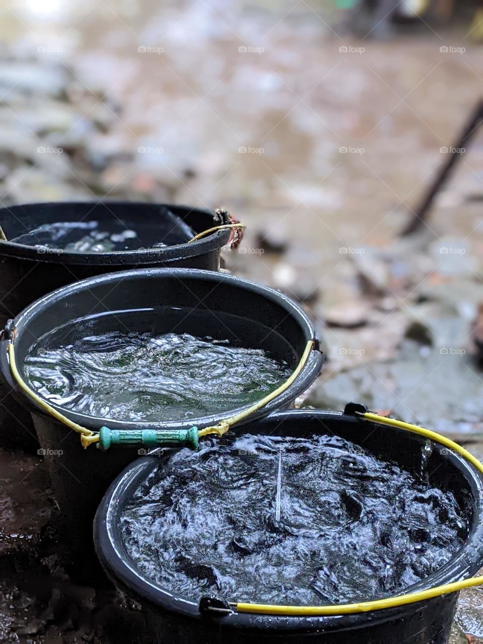 tradition in the village when it rains, collect water using a bucket.🌧️🪣😅