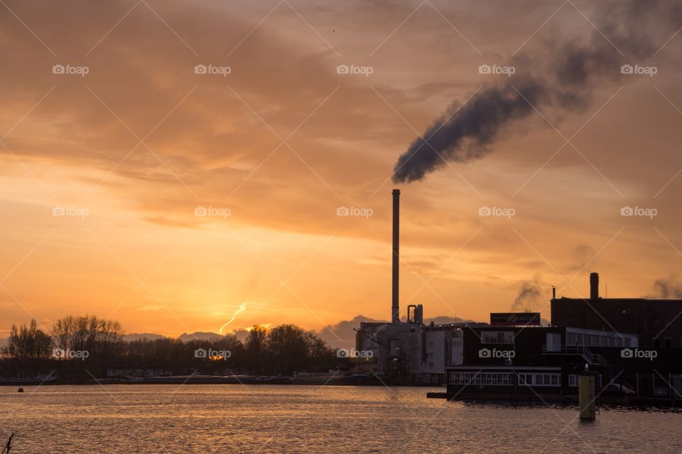 During the golden hour near a industrial factory