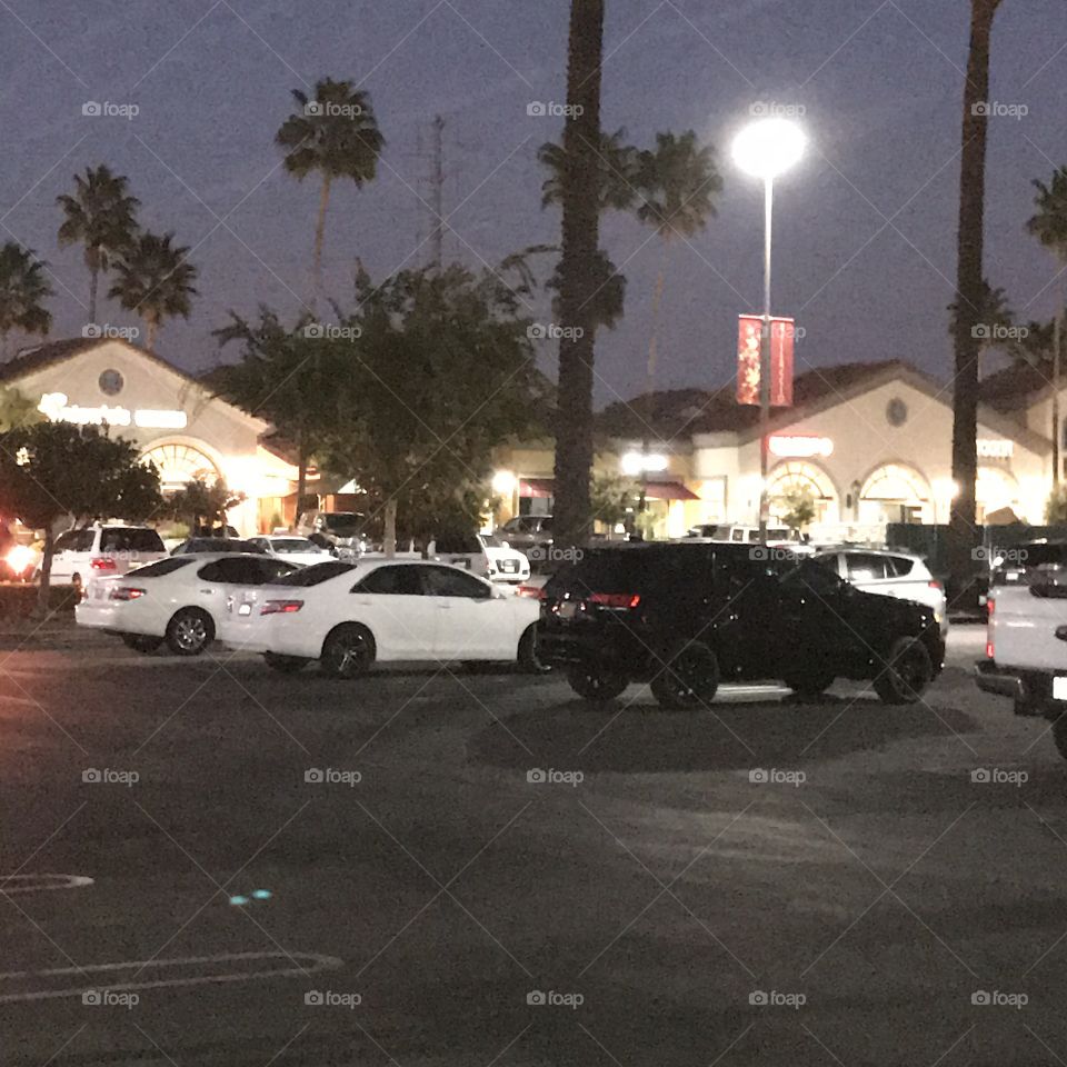 Vehicles in the parking lot at night.