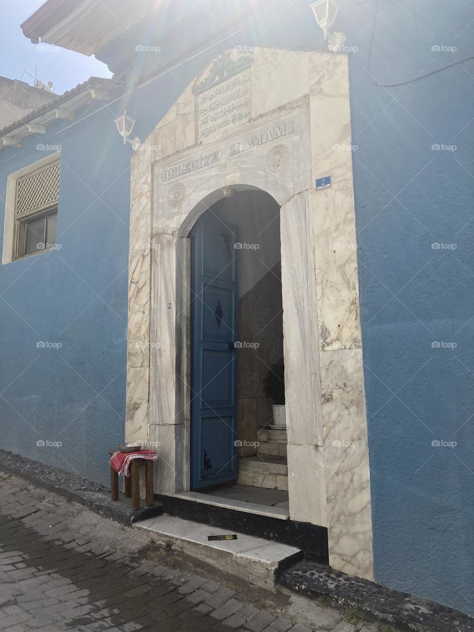 Sunny holidays I’m Turkey. Walk in the cute city and charming streets by the beach in Kusadasi. perfect blue sky and ocean view. Beach and the shore. To travel is to live. Gorgeous tall palm trees.