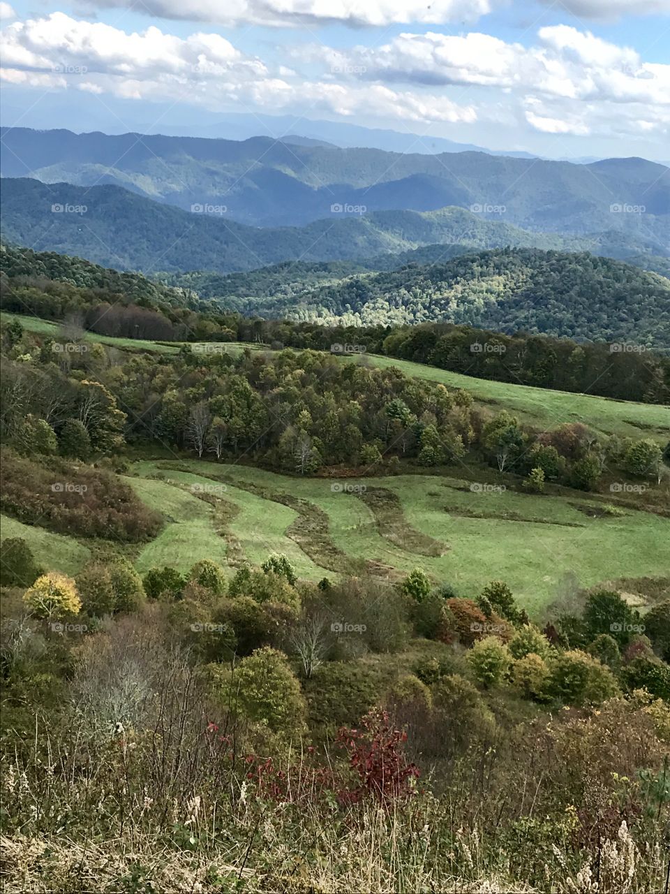 A hike up the mountain to see more mountains, trees, woodlands and farmland.  