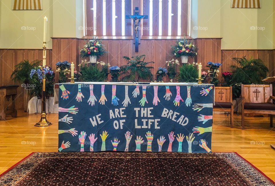 Decorations for first communion festivities made by the children themselves. This was in front of the altar. 