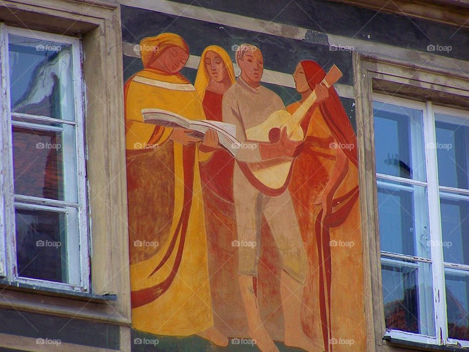 Facade of house in Old Town, Warsaw, Poland, medieval musicians, fresco, 