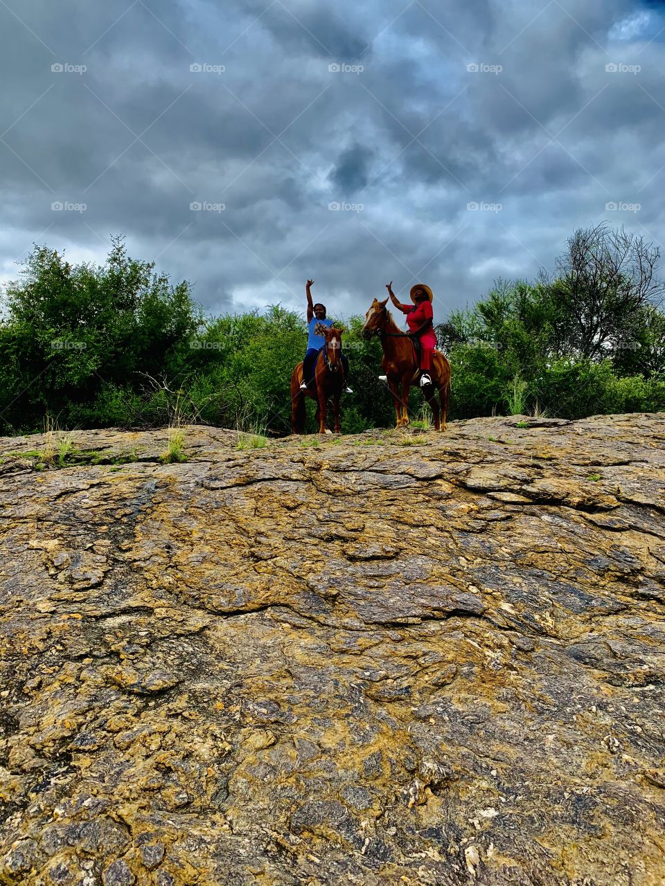 Horse riding on rocks is risky and scary but very fun on a cloudy morning. Raise your hands to great memories and fun days.