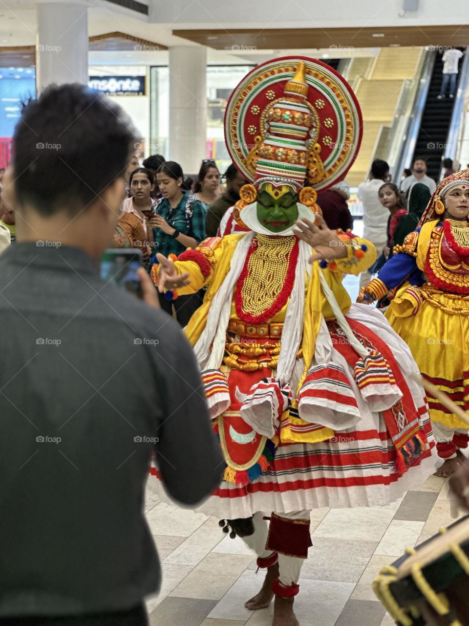 People recording video of onam dance