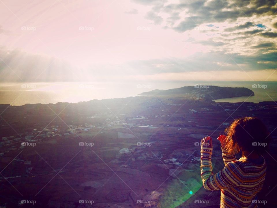 Small girl standing in sunlight