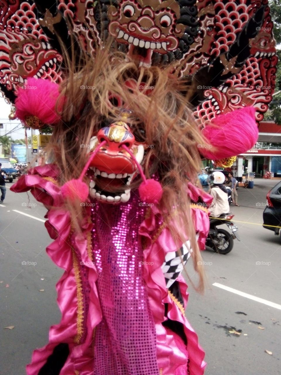 cultural carnival in Indonesia (This is a character called samboyo)