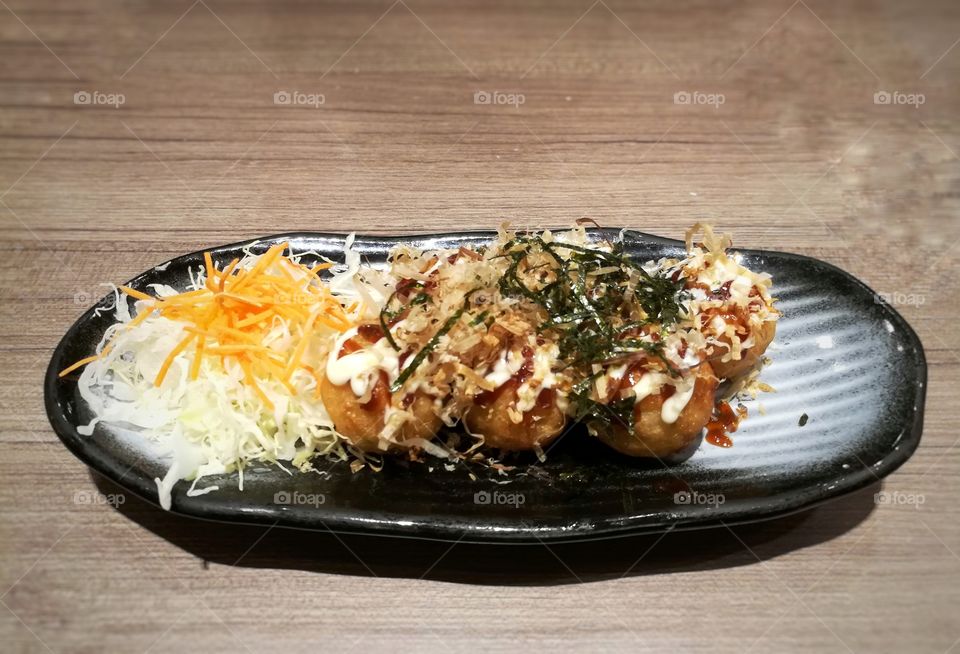 Japanese food, takoyaki on the dish.