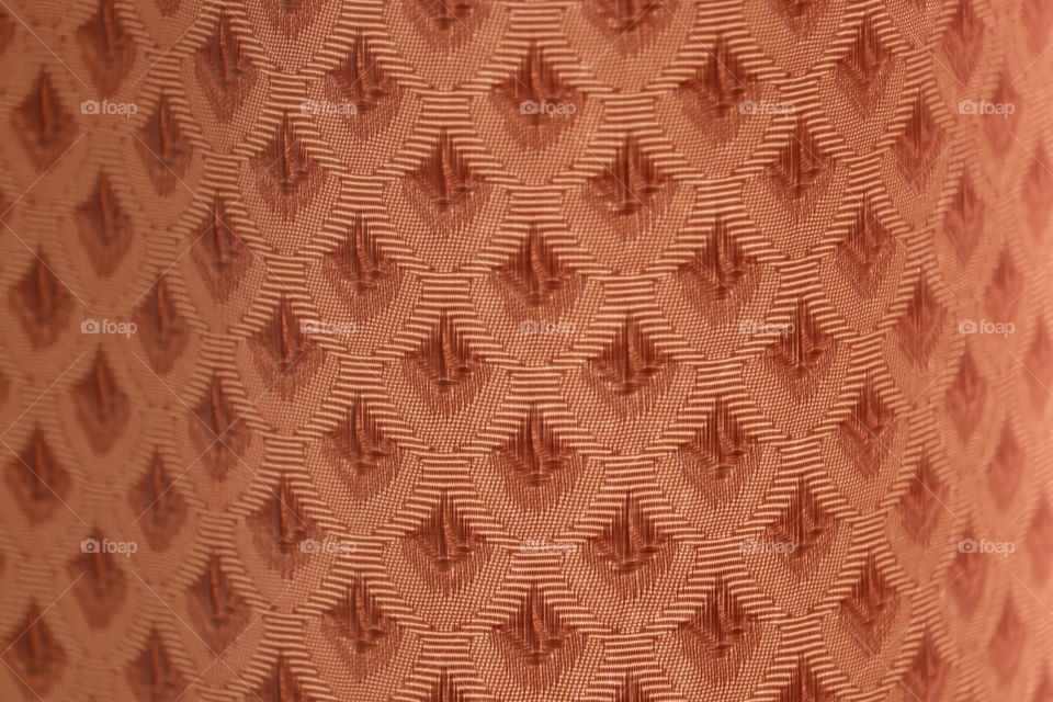 Antique damask fabric burnt orange closeup texture background image 