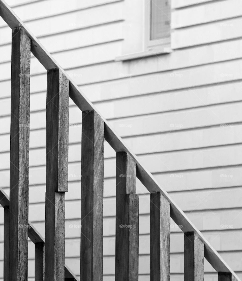 wooden stairs with a stone building background