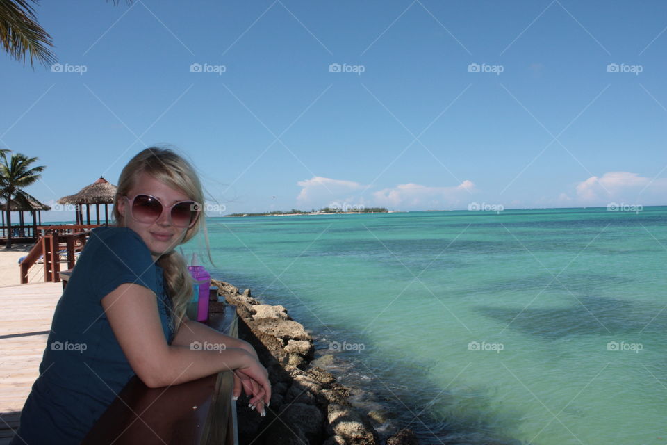 Beautiful woman sitting at beach