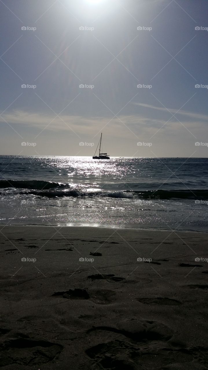 Sailboat, sea and beach.  From lovely canary islands.