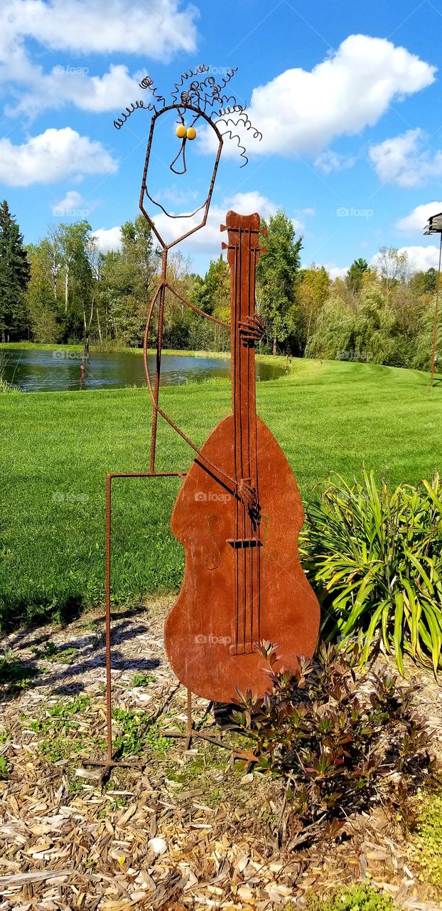 Rusty Metal musical Sculpture and pond