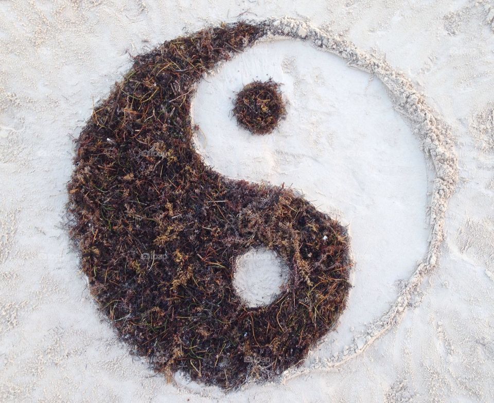 Yin yang on the beach