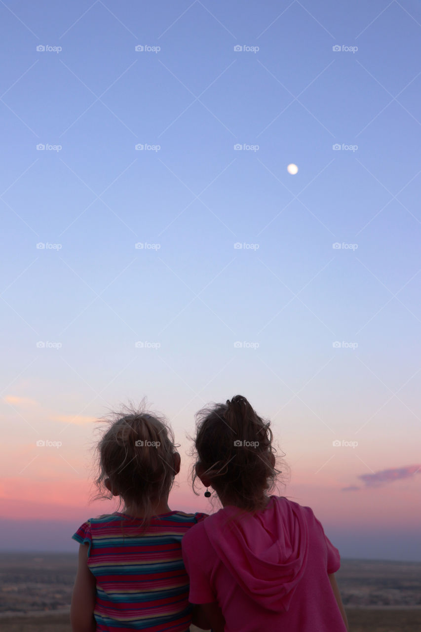 Sisters watching the sunset together