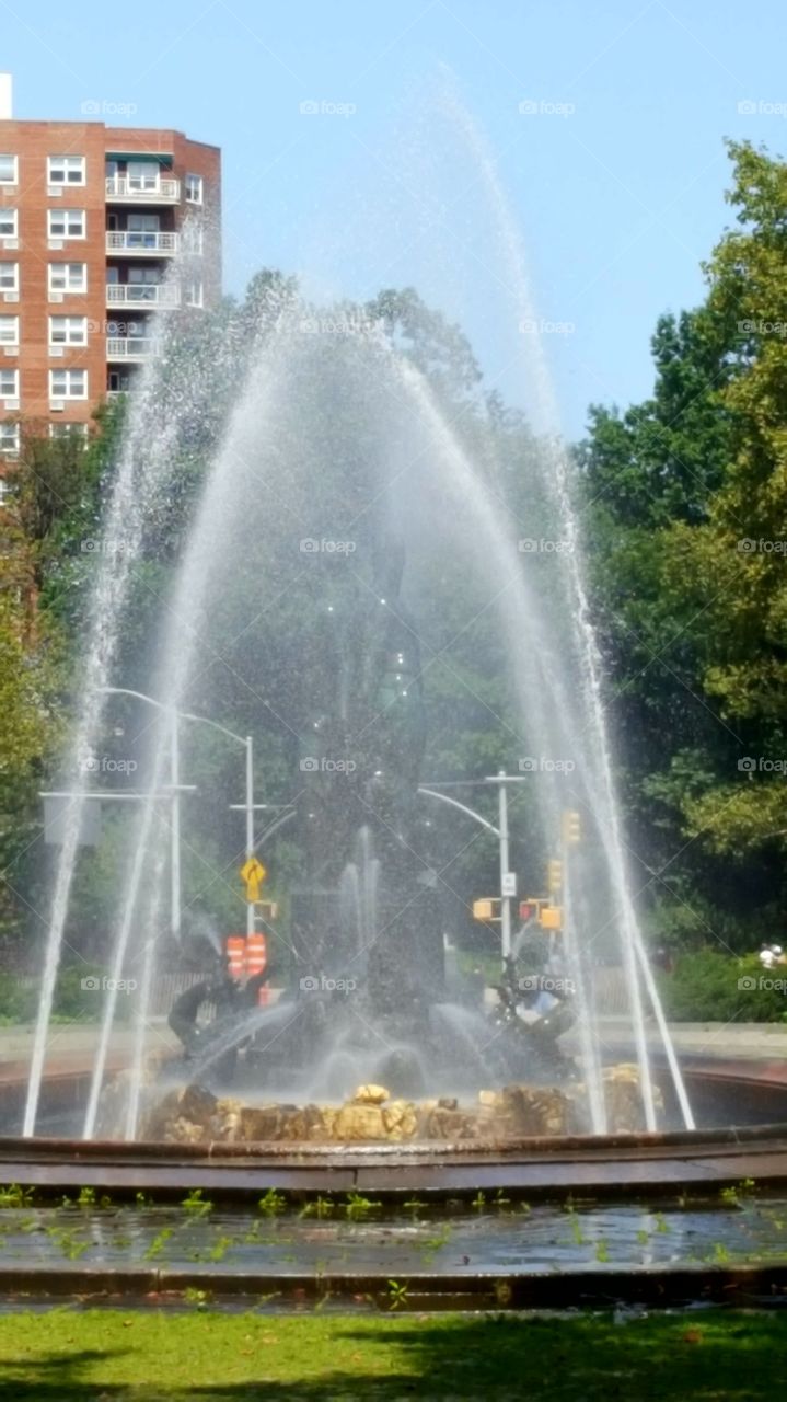 water fountain spout over statue in brooklyn grand army plaza