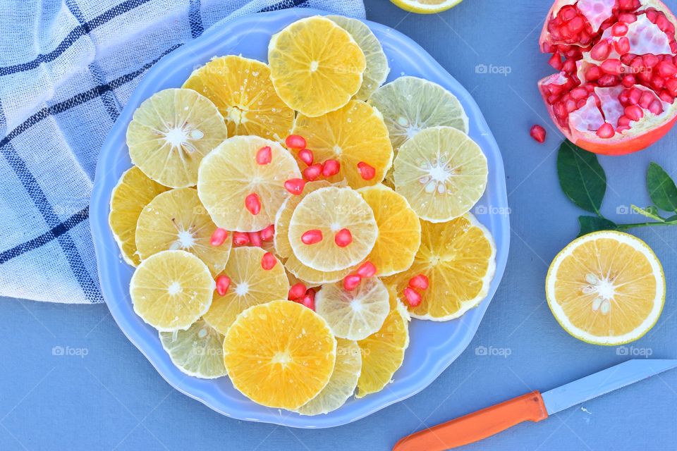 oranges and lime on a plate