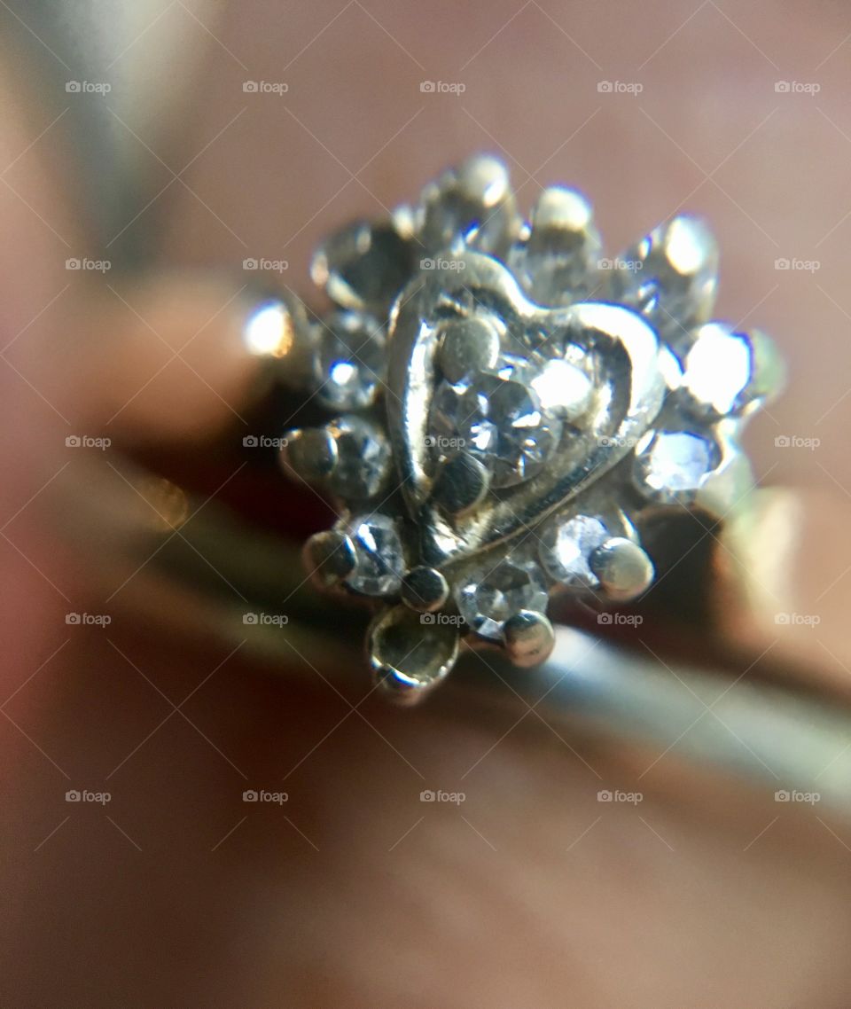 Old engagement ring missing its diamonds