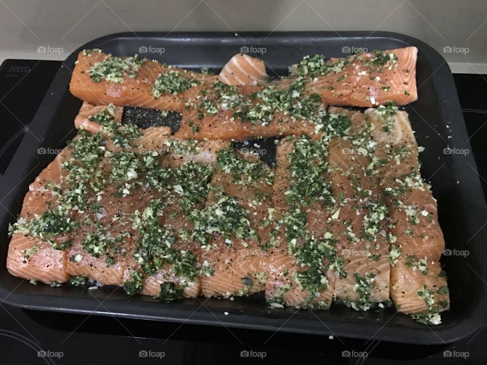 this is salmon that has been seasoned and is ready to be oven cooked for 20 minutes 