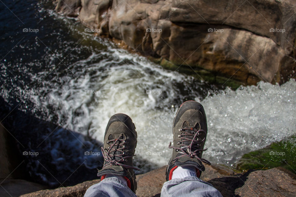 Sitting on the edge of a waterfall