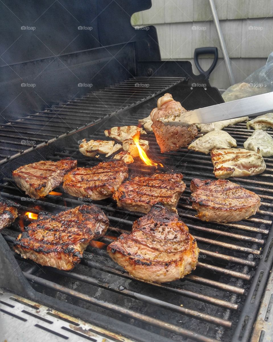 Preparation of meat on barbecue grill