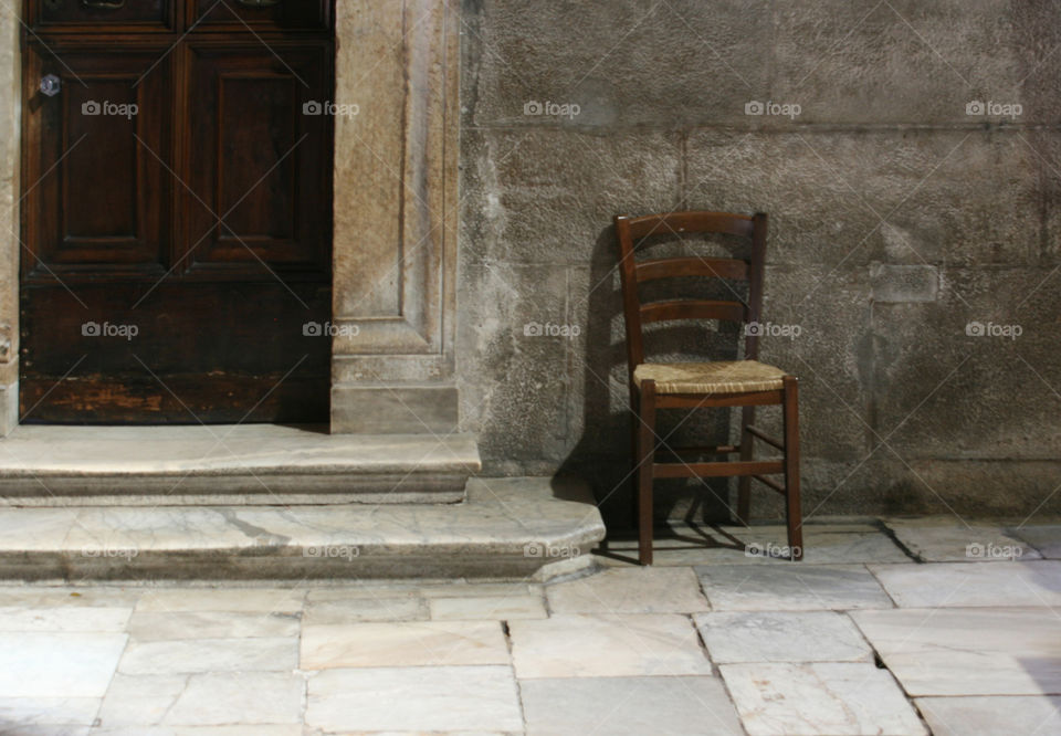 A lonely chair in an old church, Italy