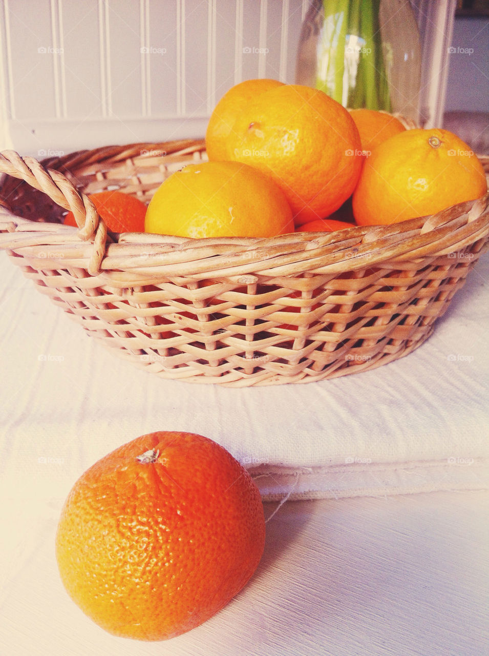 Tangerines in a basket.