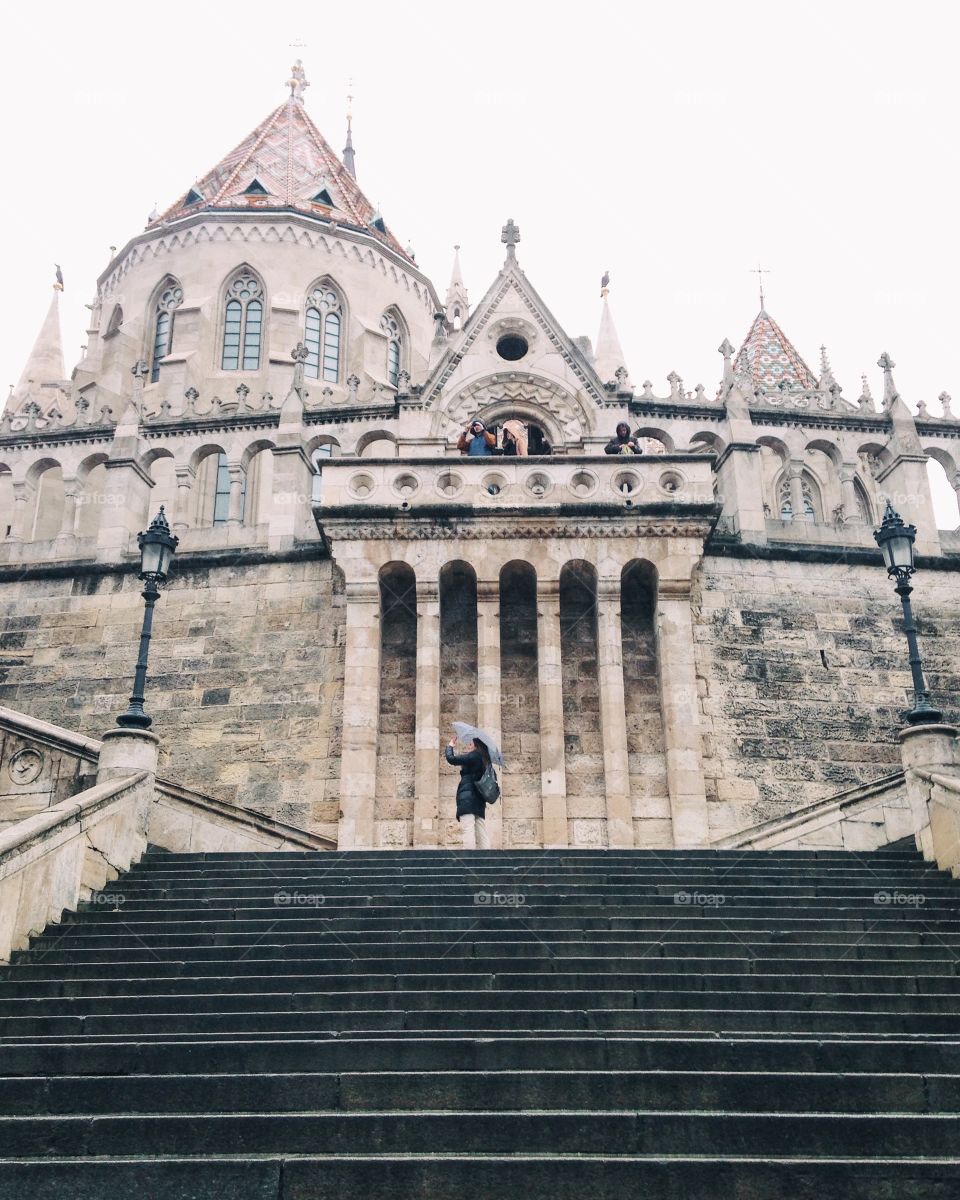 Tourists exploring castle in Budapest 
