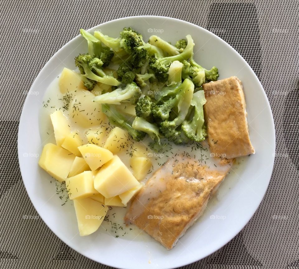 Salmon, potatoes with broccoli