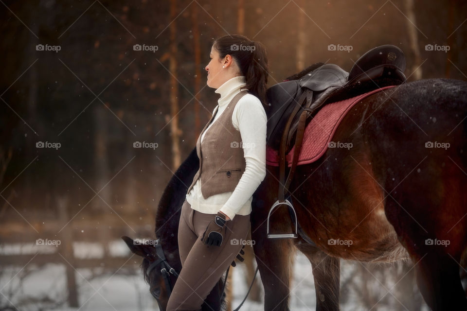 Young beautiful woman with horse outdoor portrait at spring day