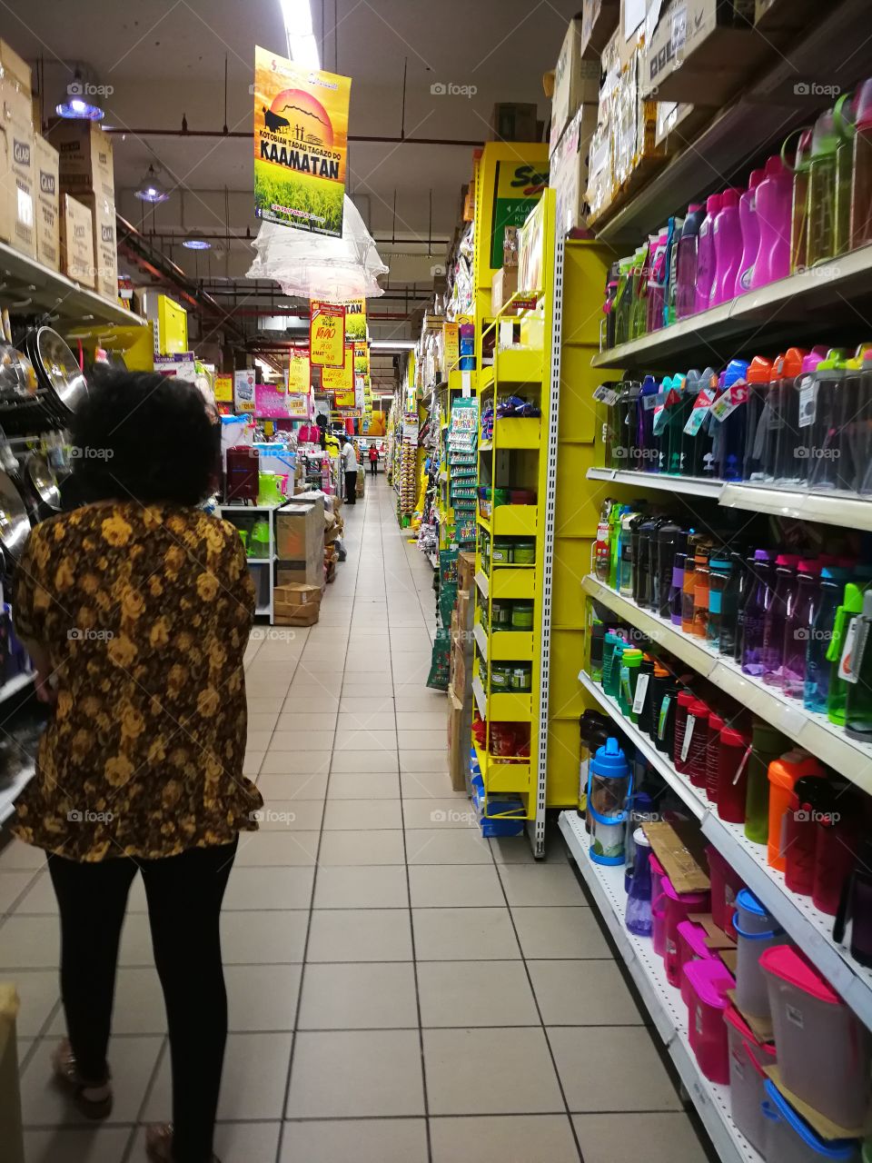 View from inside a local hypermarket with promotional indicators hanging