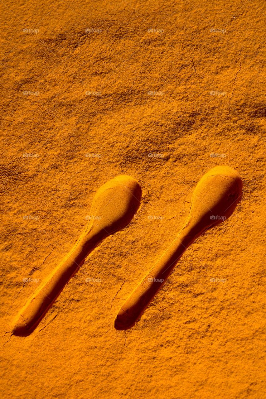 spoon impressions on turmeric powder