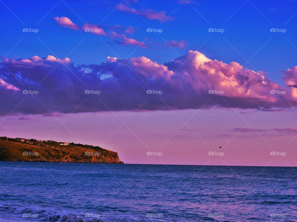 Vibrant sky and cliff at sea